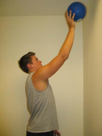 Keep your shoulder blades together and down and dribble to ball off of the wall.