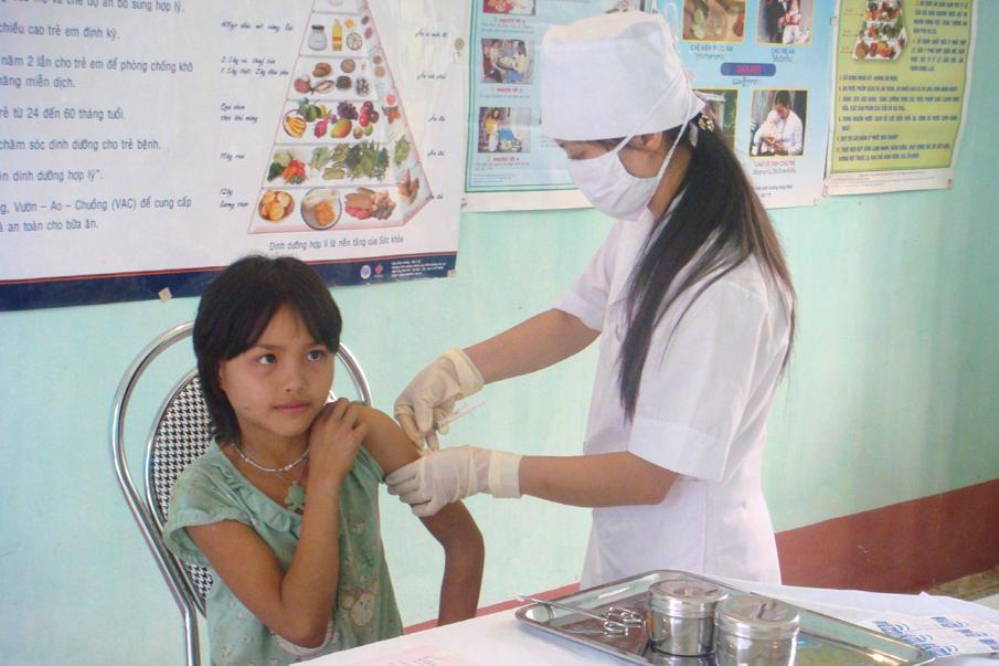 A girl being vaccinated with HPV vaccine in a commune health center.
