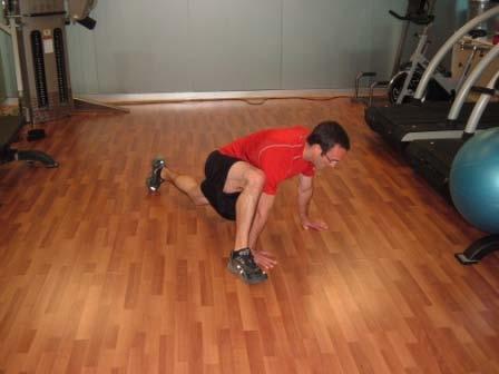 Push back to the start position. Spiderman Climb Brace your abs. Start in the top of the pushup position.