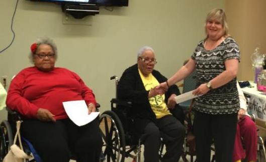 Fund. Residents presented a check to Rose Berger as