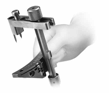 CRUCIATE RETAINING STEP TwO POSITION CUT GUIDE The system includes four different Cut Guides: a 7 guide and a 0 guide, both in left and right configurations.