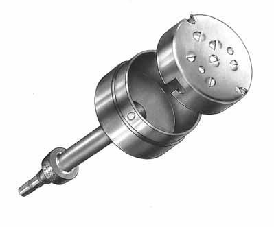 Insert the Patella Reamer Shaft into a drill/reamer. Insert the reamer assembly into the Patella Reamer Surfacing Guide. Raise the reamer slightly off the bone and bring it up to full speed.