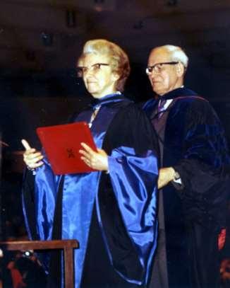 William Angus hooding Margaret Angus at Queen s University convocation in 1973 (Family photo) In 2002, at a testimonial dinner for the establishment of a scholarship in her name, the senior officer