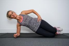 Lie face down with arms by your side, palms facing down, as shown, squeeze your bottom, tighten your hamstrings, gently pull in your belly button and lift your feet off the floor whilst also lifting