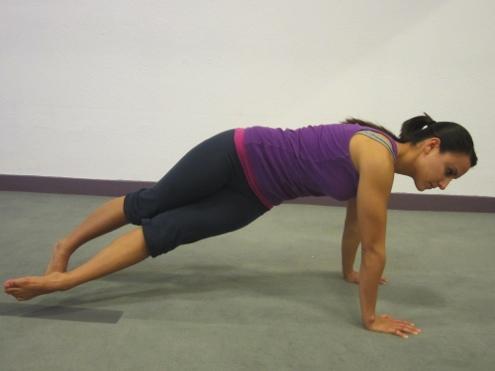 Lower back should be lengthened and pelvis slightly tucked under to prevent arching of the low back. Exhale extend left leg behind the body, Twist at the waistline. Bring the left leg across the body.