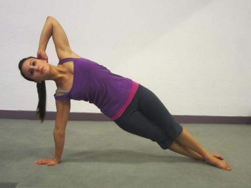 Inhale back to start position. Keep both legs lengthened and as straight as possible and together. Do not let the shoulder drop; keep distance from the ear to the shoulder throughout the movement.