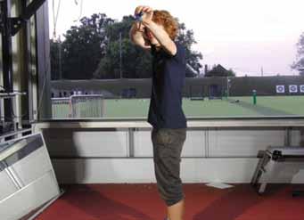 From this set position, keep your shoulders down and relaxed while raising your hands and arms to the set-up or pre-draw position.