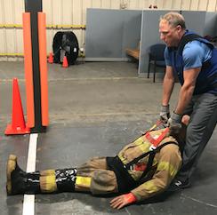 Using a back pedaling motion, you will drag the dummy 50 feet over a concrete floor surface.