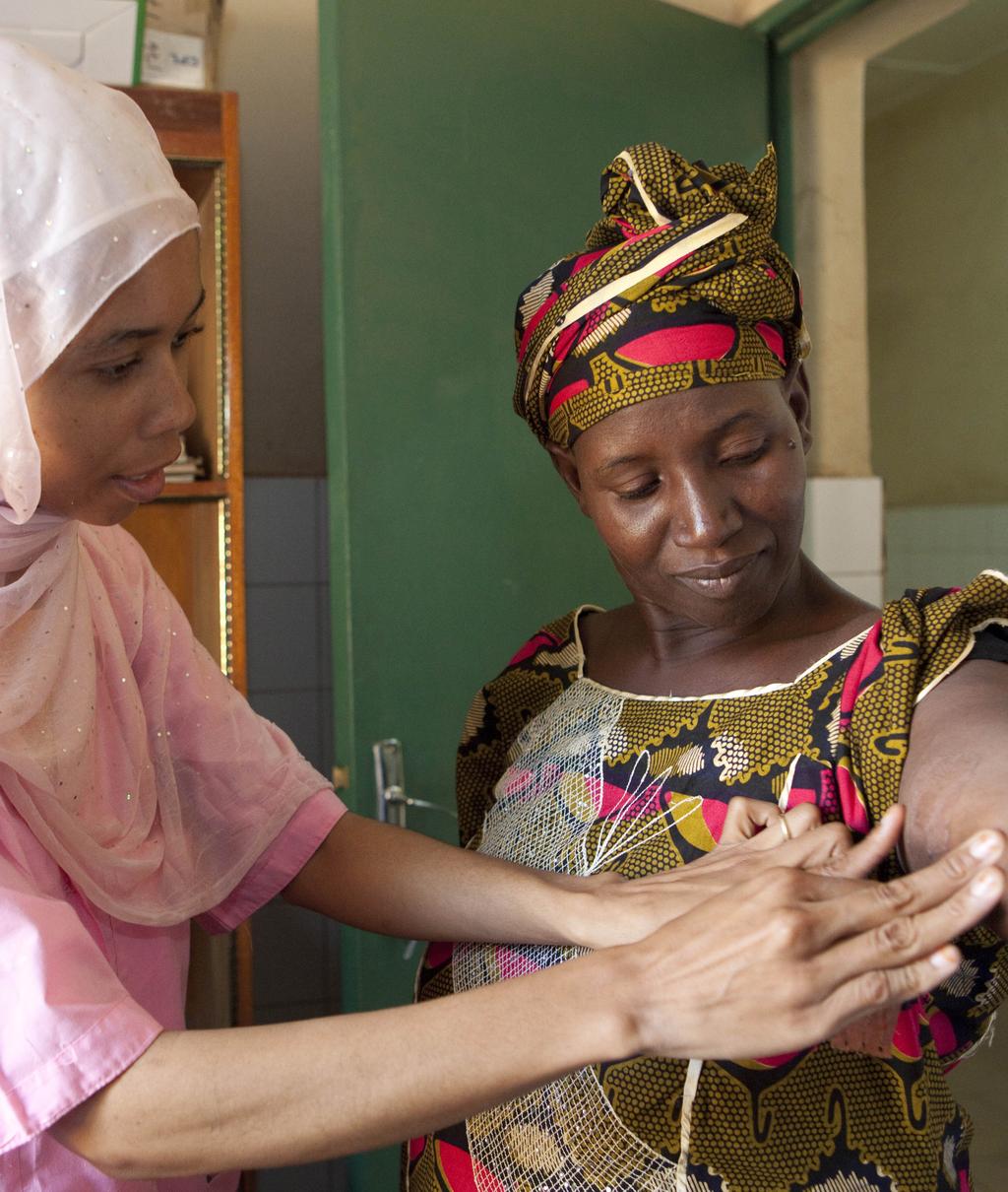 PSI/Mali Quality Assurance Coordinator Fatoumata Diawara (left) and Mariam Sangare, a satisfied user of contraceptive implants.