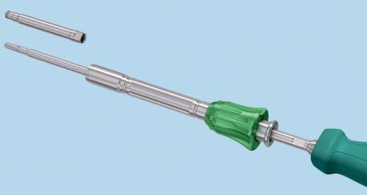 Retract the green knob while sliding the sleeve toward the handle on the screwdriver shaft until it stops.