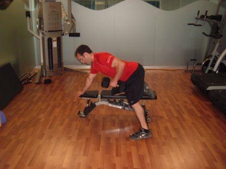 Workout A " DB Row Rest the left hand and left knee on a flat bench, lean over and keep the back flat.