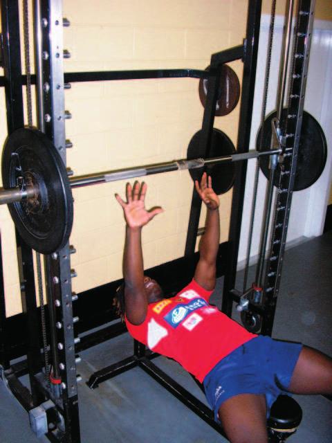 Figure 3. Bench throw exercise performed in a Smith machine.the loss of hand contact with the barbell ensures acceleration throughout the entire range of movement.