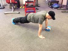 Workout A Elevated Pushups Keep the abs braced and body in a straight line from knees to shoulders.