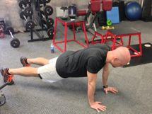 Workout C Hand Walk-out Assume the pushup position with your arms extended