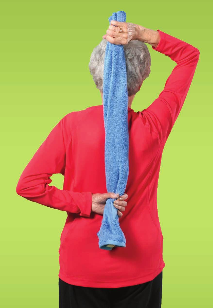 4 Reach behind your lower back and grasp the towel with your left hand. 5 Pull the towel down with your left hand.