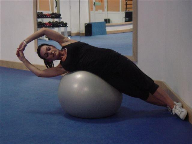 27 Side Crunch Level 2 Obliques This is a more advanced version Lie on your right side on the ball.