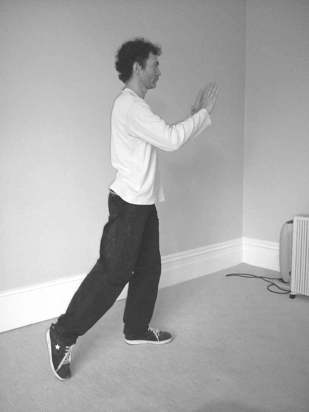 3. Shift all your weight onto your front (left) leg, straightening the leg and raising the heel of your right foot off the ground. 4.