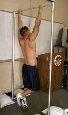 PHYSICAL PERFORMANCE TEST AND PHYSICAL FITNESS AGE PROTOCOL PULL-UP TEST Starting position from a dead hang arms fully extended and knees bent.