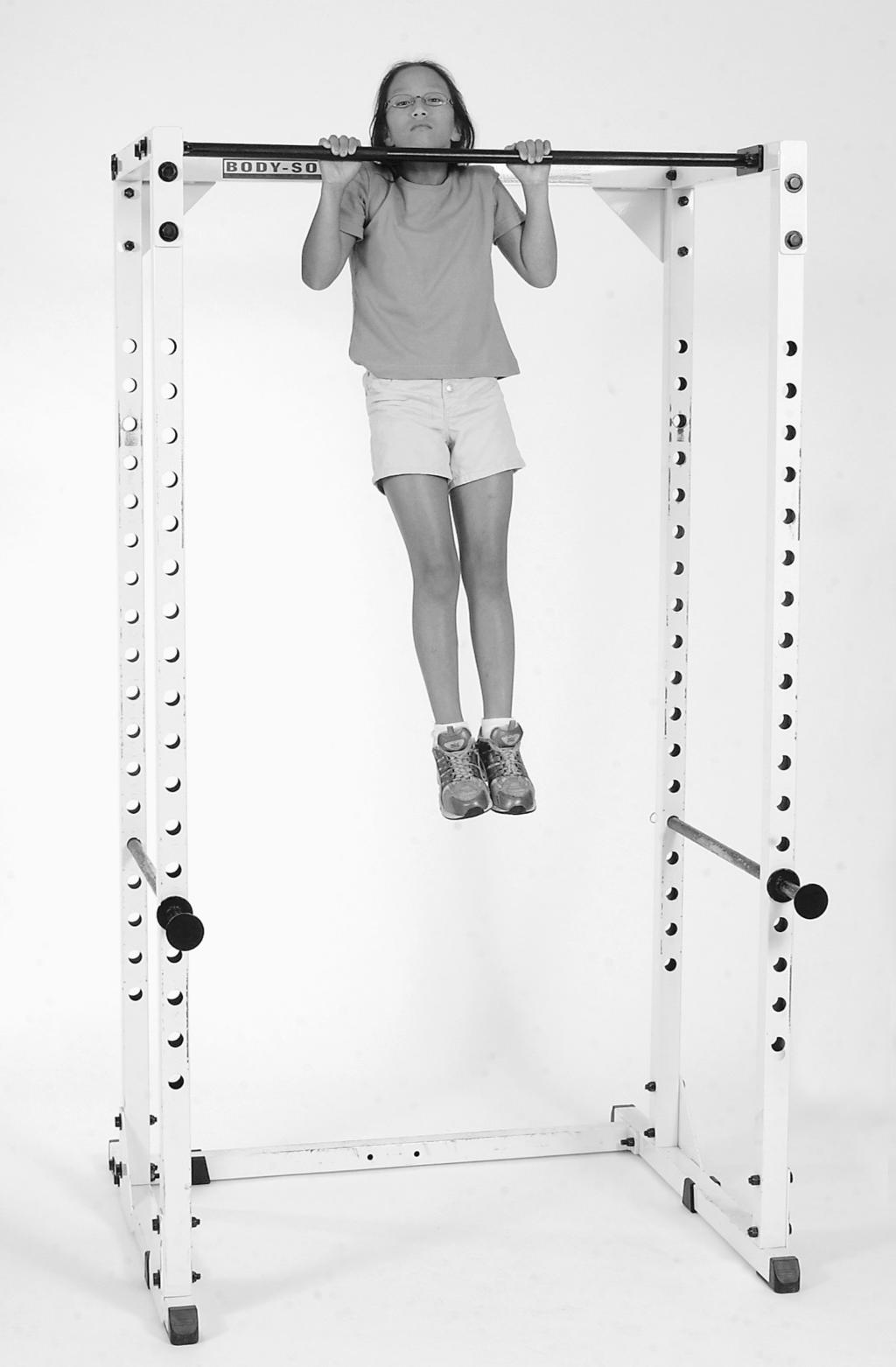 Shorter students may be lifted into the starting position. The student uses the arms to pull the body up until the chin is above the bar and then lowers the body again into the full hanging position.