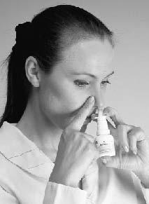 3 Close one nostril with your finger as shown, and put the nozzle in the other nostril. Tilt your head forward slightly and keep the bottle upright. Hold the bottle as shown.