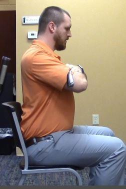 Exercise 1: Seated thoracic rotation: By sitting and using your club as a dowel, you are