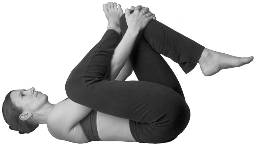 2a more flexible 2b less flexible 2a) Reach your right hand between your legs and your left around the outside of your left leg.