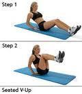 legs down further, stretch arms out overhead and fully straighten legs at the