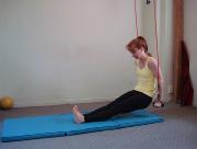 Exhale: Flex knees and curl tailbone under to bring sit bones as close to backs of calves as possible.