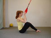 Cross one ankle over the other and lean forward slightly to feel a stretch in the piriformis. Inhale: Stay, deepening the stretch.