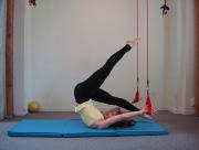 floor; Inhale: Extend the legs to the ceiling as far as balance can be maintained Exhale: Lower one leg between the