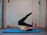 Repeat, other leg lowers and opposite leg reaches further to the ceiling Taking weight onto head and neck to balance