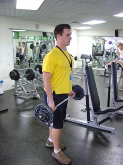 Standing Bicep Curl Bicep Curl Setup: Pick up the barbell off the floor with your palms facing away from your body. Your grip should be about shoulder width apart.