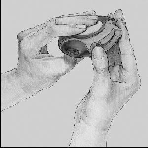 2 Hold your Diskus with the mouthpiece towards you. You can hold it in either your right or left hand. Slide the lever away from you as far as it will go.