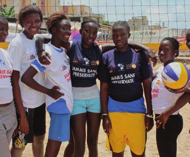 A beach volleyball team prepares for a tournament organized by Summer Tour at Ngor beach, Dakar.