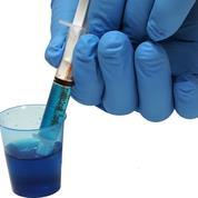 If the medication is delivered in a dose cup it needs to be transferred to an enteral syringe and the syringe can