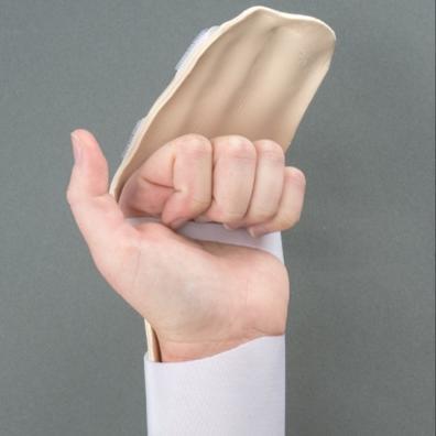 While wearing your splint, bend your fingers into a fist with your opposite hand. Straighten your fingers with your opposite hand.