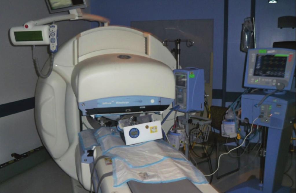 This image is from a test with the nebulizer placed 32 cm from the nasal prongs (position B). Fig. 2. Gamma camera, infant lung simulator, nasal CPAP circuit, nasal CPAP generator, and ventilator.