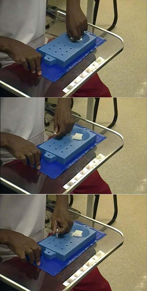 Figure 3.3 Participant performing the Nine-hole Peg Test during the inter-train interval.