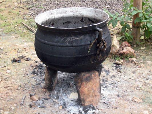 The cooking pot sits on three