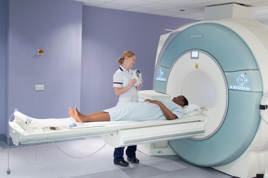 Figure 1 shows an MRI scanner What are the benefits of a MRI scan?