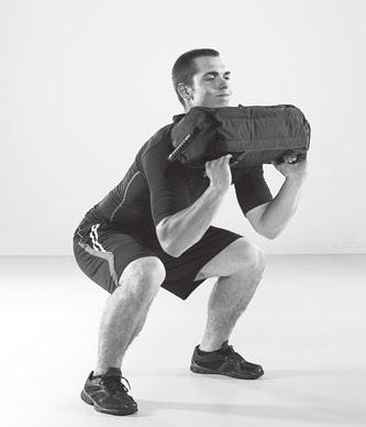 STEP 4 When your elbows reach the maximum height and your body is fully extended, pull your body under the sandbag by rotating your elbows underneath and forward.