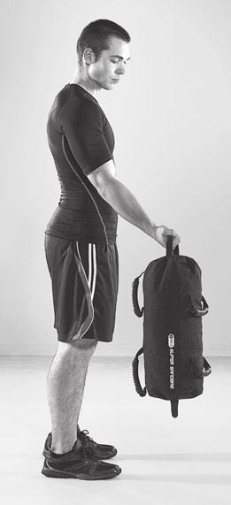 STEP 2 Keeping your elbows at your sides, curl the sandbag up to your shoulders.