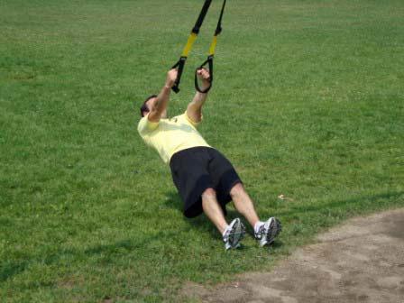 Workout A Strap/Band Row Grab the straps and take 2 steps backward.