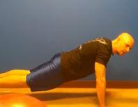 in a pushup position. Thrust your feet back in and then stand up.
