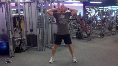 Workout C Prisoner Squat Stand with your feet just greater than shoulder-width apart.