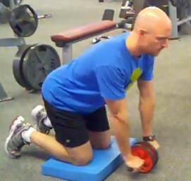 Workout C Ab Wheel Rollout Kneel on a mat with your hands on the ab wheel.