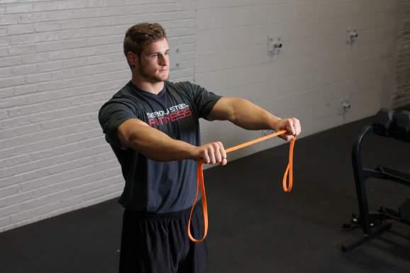 SHOULDER ACTIVATION: Grab the band about 1 foot in from