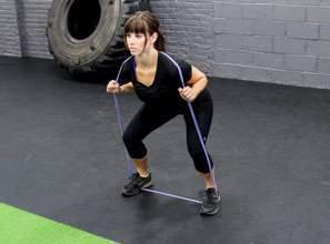 LEG EXERCISES SQUATS: Position feet slightly wider than shoulder width apart and secure band underneath feet. Be sure to secure band at the middle of the foot.