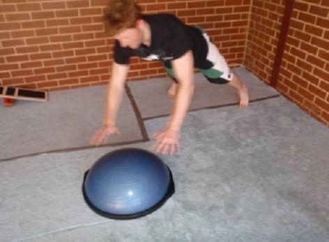 upper body so that you come down with your other hand on top of the BOSU.