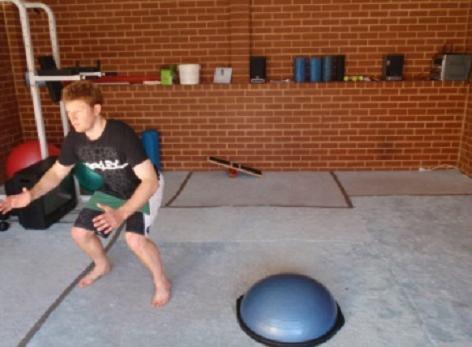 Repeat this by jumping off to the other side and then back onto the BOSU. Finally jump backwards to your starting position behind the BOSU. That is one repetition.